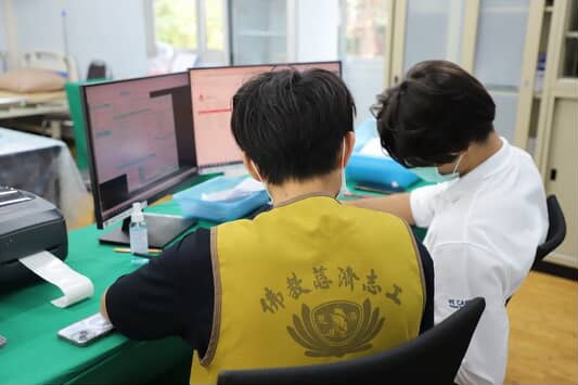 Volunteers processing patient records